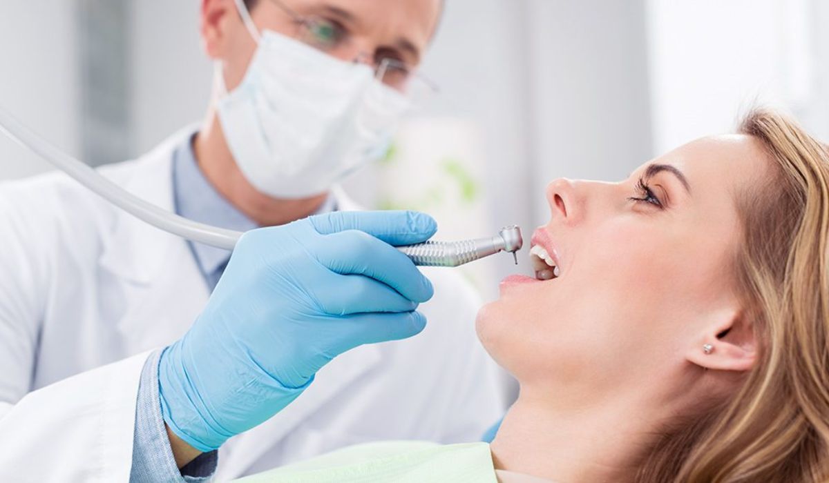 dentist checking on the patient's teeth