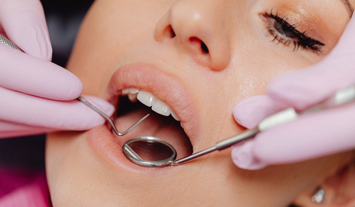 A woman was the patient receiving dental care