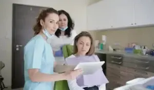 a woman with her dentist in the clinic