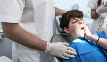 Child experiencing severe tooth pain in a dental clinic, being treated by an emergency dentist at Schaumburg Dentistry during office hours