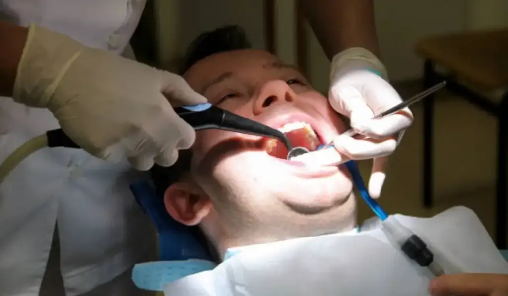 Patient undergoing a professional tooth extraction procedure by a Schaumburg dentist, ensuring comfort and quality care.